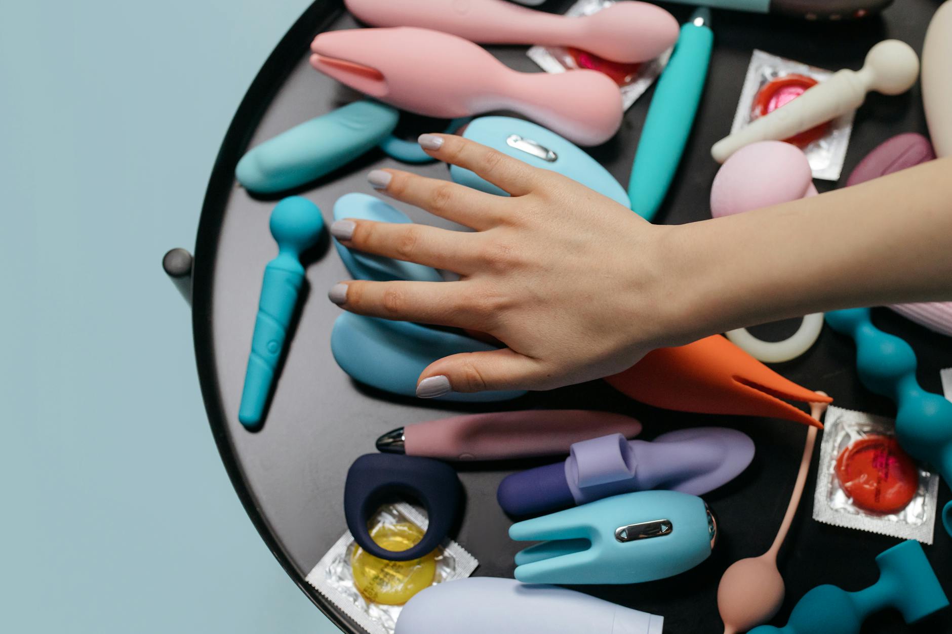 Colorful sex toys including lemon vibrators arranged on a table showing diverse pleasure options